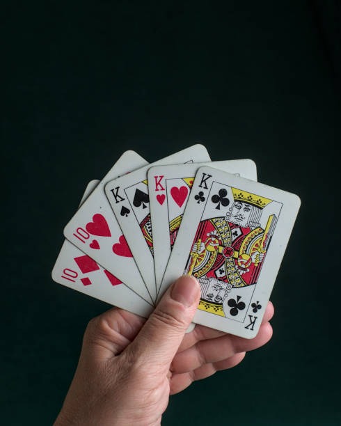 Live roulette wheel with dealer hand and betting layout